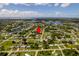 Aerial view of the neighborhood with the location of the property marked at 551 Crandall Nw St, Port Charlotte, FL 33952