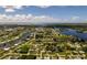 Beautiful aerial view of neighborhood surrounded by waterway and lakes at 551 Crandall Nw St, Port Charlotte, FL 33952