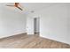 Bright bedroom featuring wood-look floors and a ceiling fan at 551 Crandall Nw St, Port Charlotte, FL 33952
