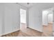 Well-lit bedroom with wood-look flooring, white walls, and ample natural light at 551 Crandall Nw St, Port Charlotte, FL 33952