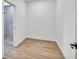 Modern-style bedroom with wood-look flooring, a closet, and attached bathroom at 551 Crandall Nw St, Port Charlotte, FL 33952