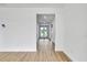 Spacious hallway with wood-look floors and ample natural light at 551 Crandall Nw St, Port Charlotte, FL 33952
