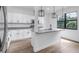 Bright kitchen features granite counters, stainless appliances, pendant lights, and a modern aesthetic at 551 Crandall Nw St, Port Charlotte, FL 33952