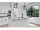 Stylish kitchen with granite counters, pendant lights, stainless appliances, and ample natural light from nearby window at 551 Crandall Nw St, Port Charlotte, FL 33952
