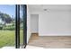 Bright, airy living room with wood floors and sliding glass doors to the backyard at 551 Crandall Nw St, Port Charlotte, FL 33952