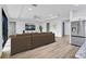 Open-concept living room with modern appliances and plenty of natural light at 551 Crandall Nw St, Port Charlotte, FL 33952