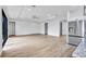 Open-concept space featuring light wood floors, an island kitchen and view of a bright and airy living area at 551 Crandall Nw St, Port Charlotte, FL 33952