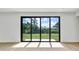 Bright living room with sliding glass doors leading to the backyard at 551 Crandall Nw St, Port Charlotte, FL 33952