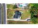 Aerial view of property with a pool, large lot, and spacious driveway with a black SUV at 5705 44Th E Ave, Bradenton, FL 34203