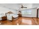 Spacious bedroom features hardwood floors, a ceiling fan, and a large window with natural light at 5705 44Th E Ave, Bradenton, FL 34203