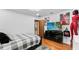 Bedroom boasting minimalist decor, a flat screen TV, and wood-look flooring at 5705 44Th E Ave, Bradenton, FL 34203