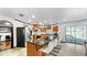 Spacious kitchen features a large island with seating, stainless steel appliances, and oak cabinetry, ideal for cooking and entertaining at 5705 44Th E Ave, Bradenton, FL 34203