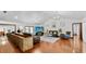 Spacious living room with hardwood floors, stylish furnishings, and a seamless connection to other areas of the home at 5705 44Th E Ave, Bradenton, FL 34203