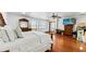 Spacious main bedroom with gleaming wood floors, large window, and a walk-in closet for ample storage at 5705 44Th E Ave, Bradenton, FL 34203