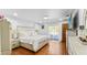 Bright main bedroom featuring a comfortable bed, nightstands, dresser, and private patio at 5705 44Th E Ave, Bradenton, FL 34203