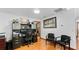 Bright office with desk, two chairs, and artwork, ready for productivity at 5705 44Th E Ave, Bradenton, FL 34203