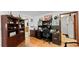 Cozy office space with custom built-in shelving, desk, and hardwood floors at 5705 44Th E Ave, Bradenton, FL 34203