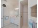 Bright bathroom with walk-in shower and white cabinetry at 5733 White Jasmine Way, North Port, FL 34287