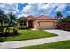 Inviting single-Gathering home with a well-kept lawn, mature palm trees, and a two-car garage at 5733 White Jasmine Way, North Port, FL 34287