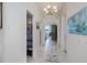 Hallway view with view to the main bedroom at 5733 White Jasmine Way, North Port, FL 34287