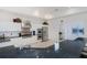 Spacious kitchen with white cabinetry, stainless steel appliances, and granite counters at 5733 White Jasmine Way, North Port, FL 34287