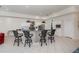 Gourmet kitchen features white cabinetry and a large center island with seating for four and designer details at 5733 White Jasmine Way, North Port, FL 34287