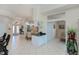 Open-concept living space with tile flooring, dining area, and access to other rooms at 5733 White Jasmine Way, North Port, FL 34287