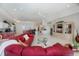 Open concept floor plan with the living room and kitchen next to each other; neutral tile flooring throughout at 5733 White Jasmine Way, North Port, FL 34287