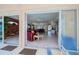 Spacious living room with tile floors, open to kitchen and dining, visible from patio seating at 5733 White Jasmine Way, North Port, FL 34287
