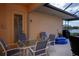 Outdoor patio with dining set, great for al fresco dining and relaxation at 5733 White Jasmine Way, North Port, FL 34287