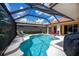 This screened-in pool is perfect for relaxation and entertaining, and has great views at 5733 White Jasmine Way, North Port, FL 34287