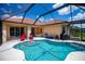 Screened-in pool with adjacent lounge area and patio furniture for outdoor relaxation and entertaining at 5733 White Jasmine Way, North Port, FL 34287