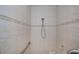 A closer view of the shower with updated tilework and a built-in seat at 5733 White Jasmine Way, North Port, FL 34287