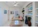 Comfortable sitting room featuring shelving and a decorative guitar at 5733 White Jasmine Way, North Port, FL 34287