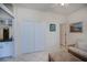 Comfortable sitting room features a closet, white cabinets, and access to multiple rooms at 5733 White Jasmine Way, North Port, FL 34287