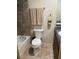 Bathroom featuring tiled walls, a tub, and modern fixtures at 6327 Fabian Rd, North Port, FL 34287