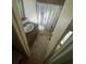 Traditional half-bath features tiled flooring, toilet, and pedestal sink; compact and efficient space at 6327 Fabian Rd, North Port, FL 34287