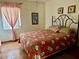 Comfortable bedroom with window and decorative bedspread at 6327 Fabian Rd, North Port, FL 34287