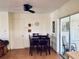 Open dining room space with a dark wood table set and sliding door access to patio at 6327 Fabian Rd, North Port, FL 34287