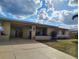 Charming single-story home with a well-maintained lawn, mature landscaping and a convenient covered carport at 6327 Fabian Rd, North Port, FL 34287