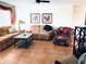 Cozy living room featuring comfortable seating, tile flooring, and a ceiling fan at 6327 Fabian Rd, North Port, FL 34287