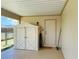Covered patio featuring a utility shed for extra storage and adjacent hose hookup at 6327 Fabian Rd, North Port, FL 34287