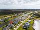 Waterfront homes sit on canals in an aerial view of a beautiful neighborhood with lush landscapes at 1091 Rotonda Cir, Rotonda West, FL 33947