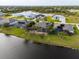 Aerial view of the community showcasing waterfront properties with private, screened-in pools at 1091 Rotonda Cir, Rotonda West, FL 33947