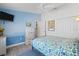 Comfortable bedroom featuring colorful accent walls, modern furnishings, and ample storage with white closet doors at 1091 Rotonda Cir, Rotonda West, FL 33947