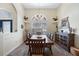 Traditional dining room featuring a dark wood table with seating for eight, complemented by a charming chandelier at 1091 Rotonda Cir, Rotonda West, FL 33947
