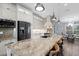 Modern kitchen features granite countertops, stainless steel appliances, and custom cabinetry at 1091 Rotonda Cir, Rotonda West, FL 33947