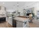 Beautiful open-concept kitchen with island seating and modern fixtures at 1091 Rotonda Cir, Rotonda West, FL 33947
