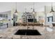 Spacious living room with elegant decor, tv and outdoor access at 1091 Rotonda Cir, Rotonda West, FL 33947