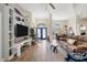 Open living room featuring hardwood floors, fireplace, and ample natural light at 1091 Rotonda Cir, Rotonda West, FL 33947